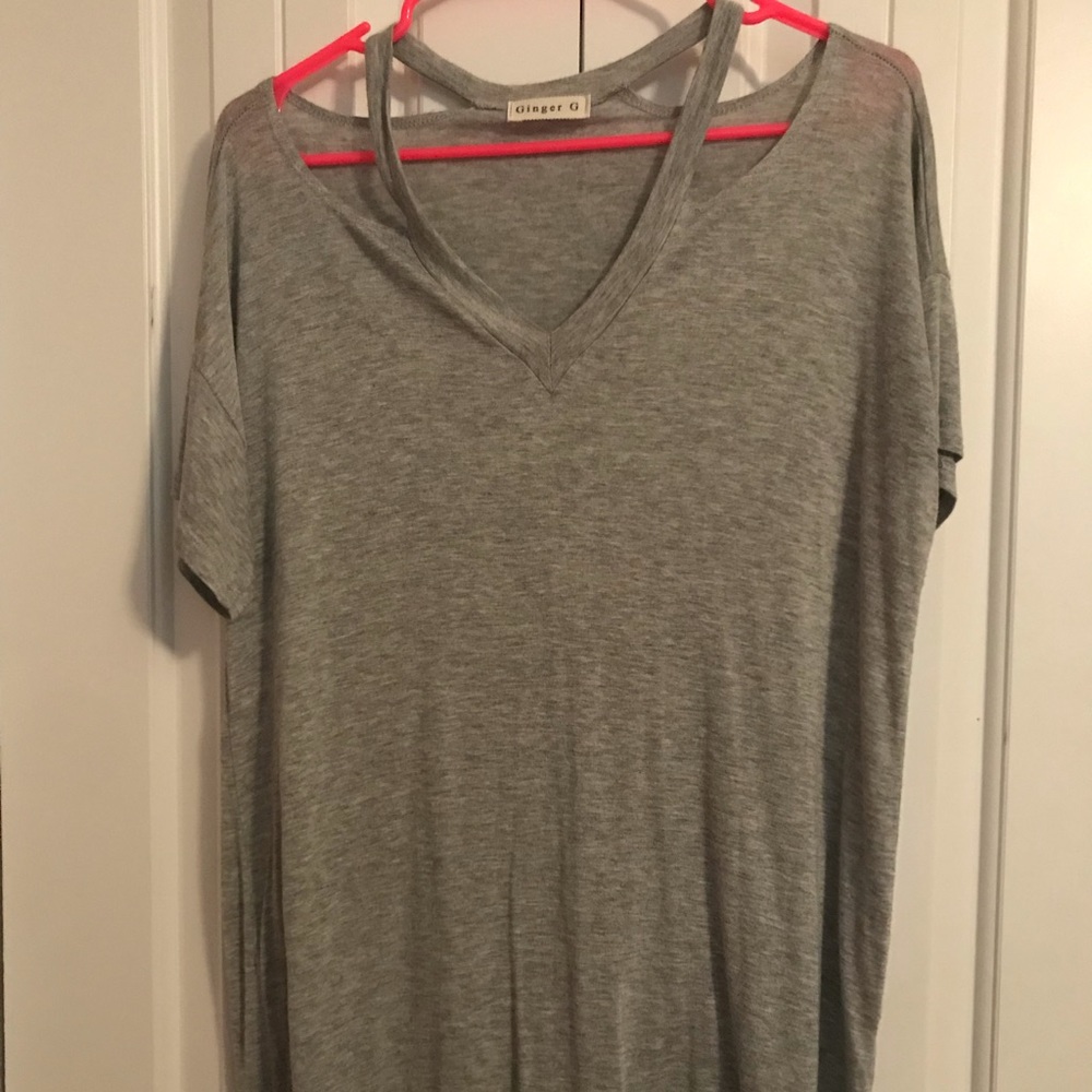 Long, shoulder cut out top.